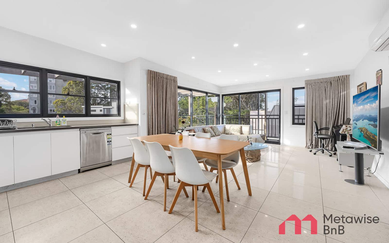 Open-plan living and dining of a MetaWise-managed two-bedroom apartment in Bondi Junction.