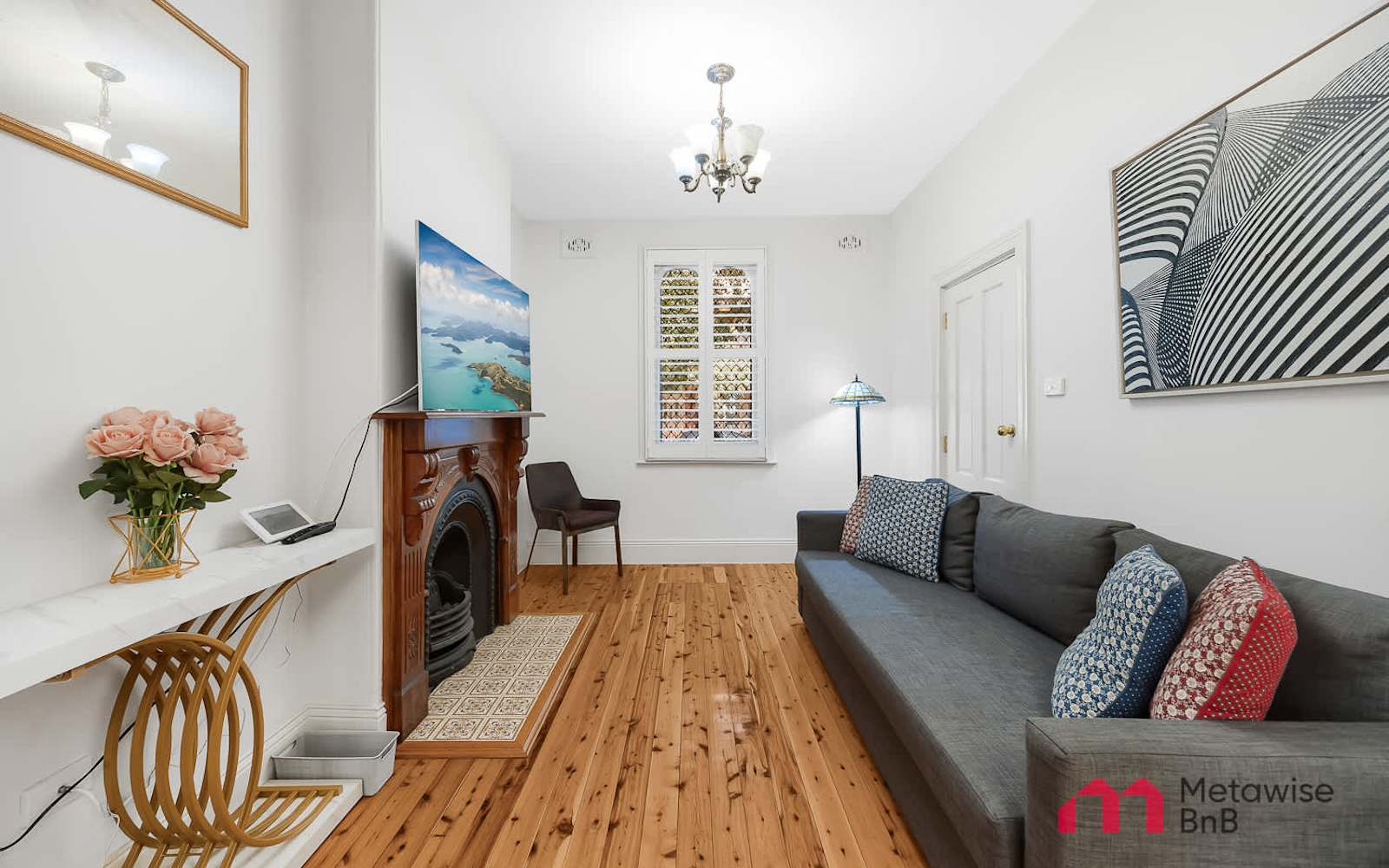Front room of a three-bedroom terrace in Millers Point that MetaWise manages, fireplace and timber floors.