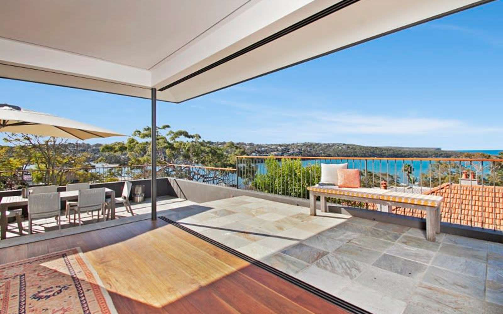 Covered terrace of a Mosman home looking out over Middle Harbour.